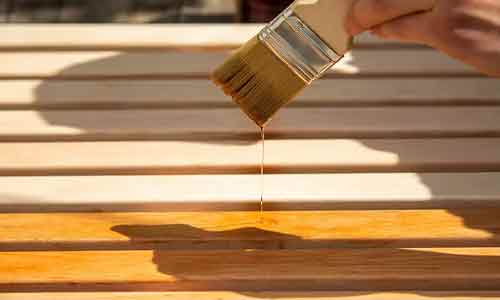 Wood deck staining in progress